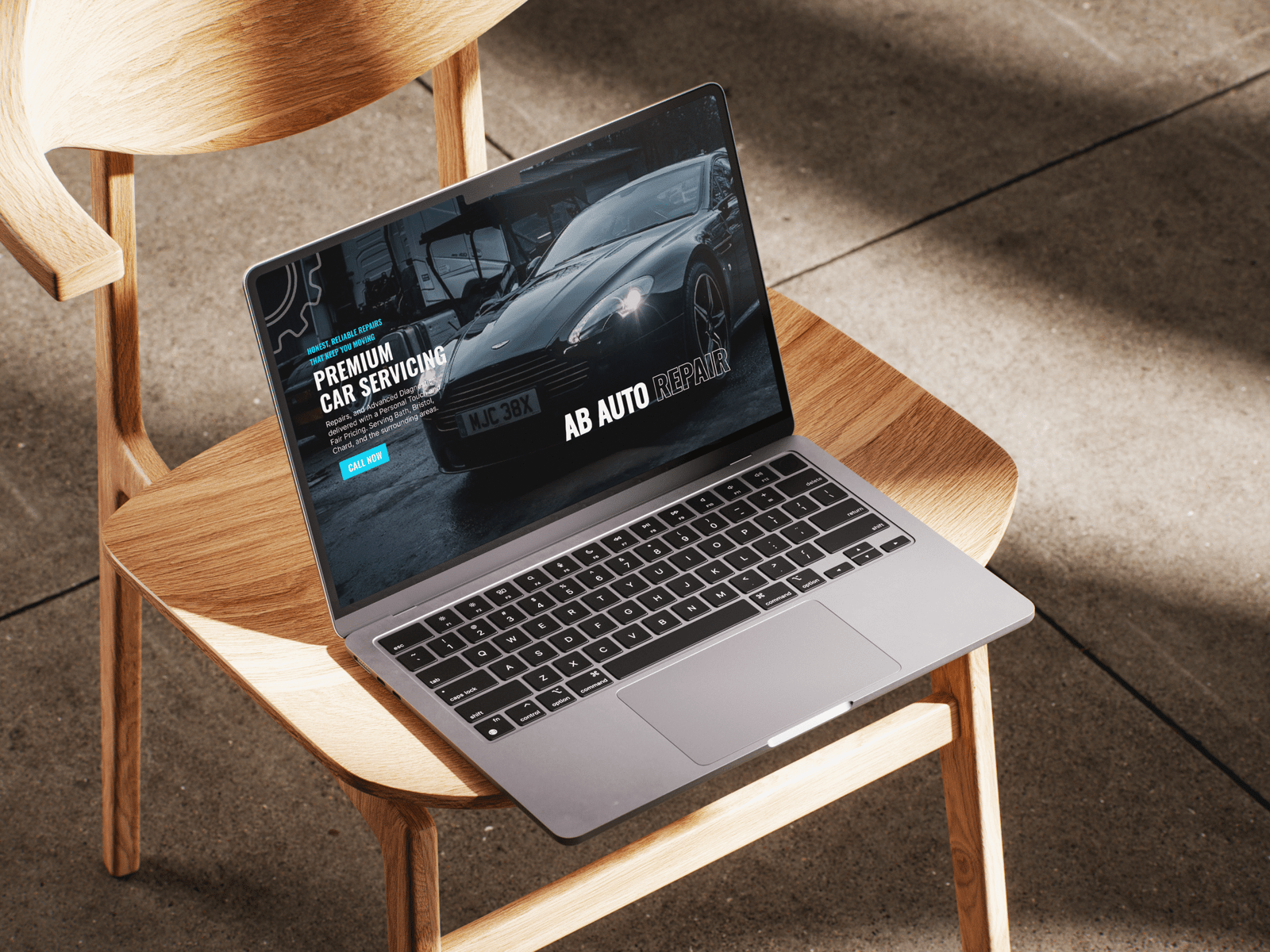 Laptop displaying a modern responsive website for AB Auto Repair, a UK small business serving Bath and Bristol.